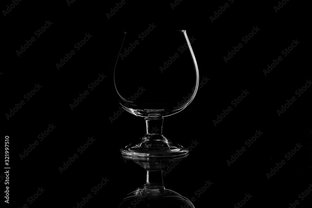 Empty glass silhouette isolated on black background