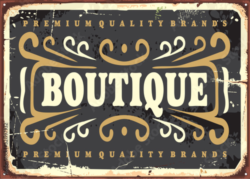 Vintage boutique sign with decorative elements on black background. Fashion business poster template. Vector illustration.