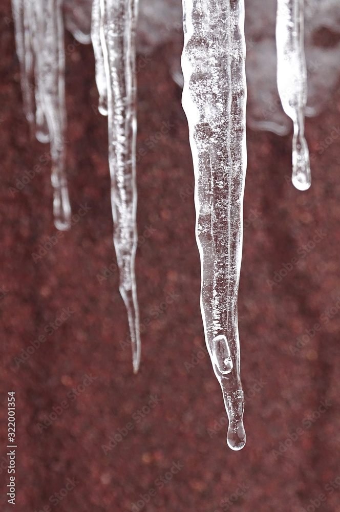 icicles on the roof after snowy cold weather icicles on the roof after snowy cold weather