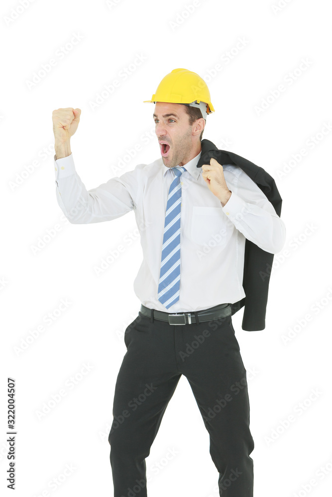 Standing smart engineer in white shirt wearing yellow helmet showing fist and shouting isolated on white background Standing smart engineer in white shirt wearing yellow helmet showing fist and shouting isolated on white background