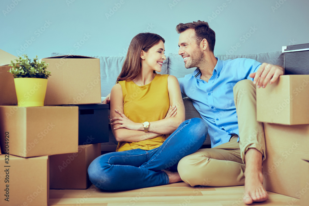 Happy couple moving in to new apartment Happy couple moving in to new apartment
