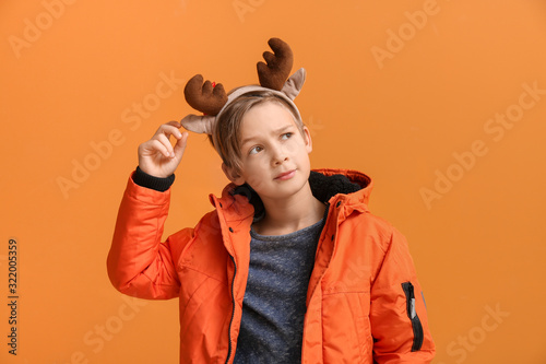 Cute little boy with deer h...