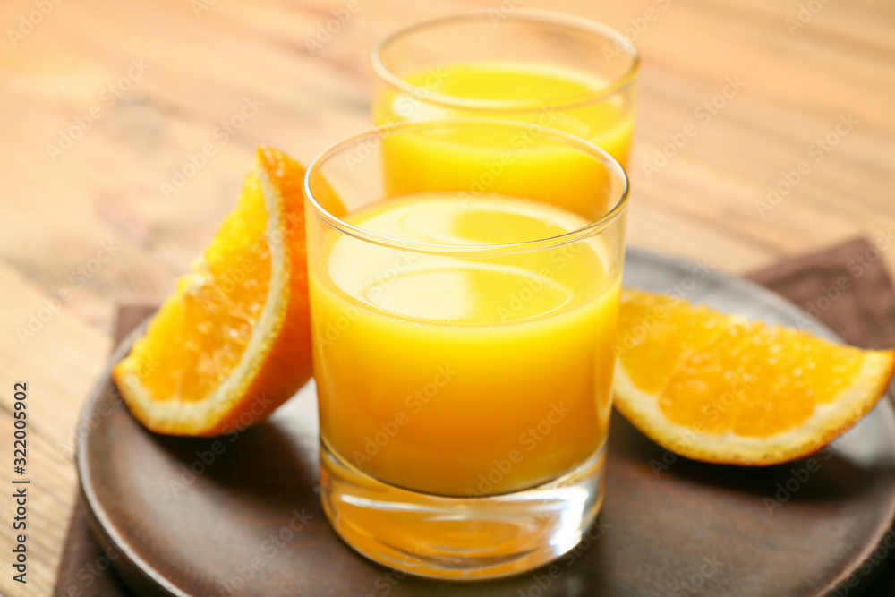 Glasses of fresh orange juice on table Glasses of fresh orange juice on table
