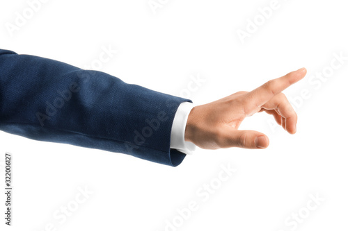 Young businessman using virtual screen on white background