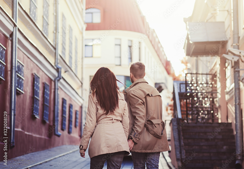 Portrait of romantic couple walking in european city