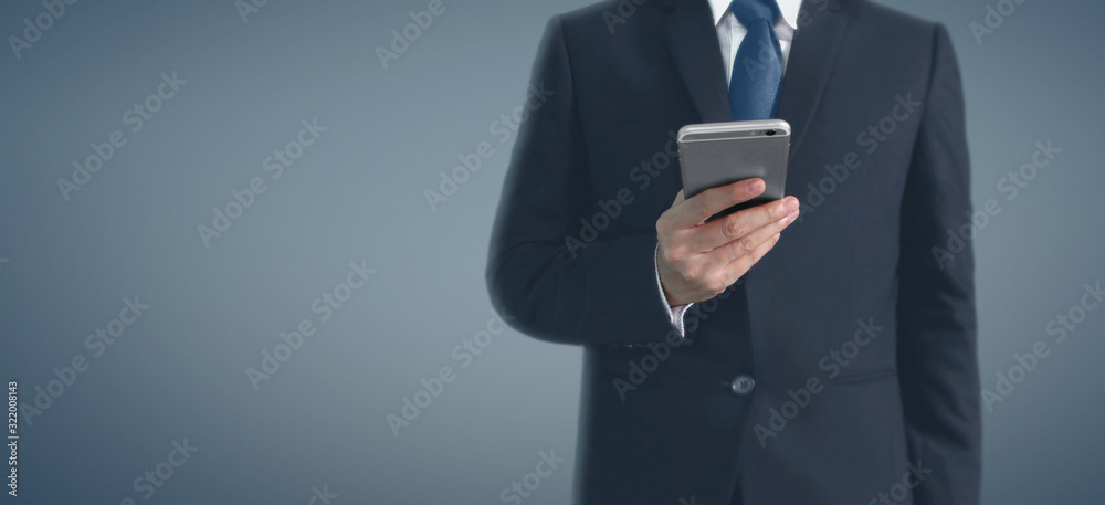 Man hand holding smartphone device and touching screen Man hand holding smartphone device and touching screen