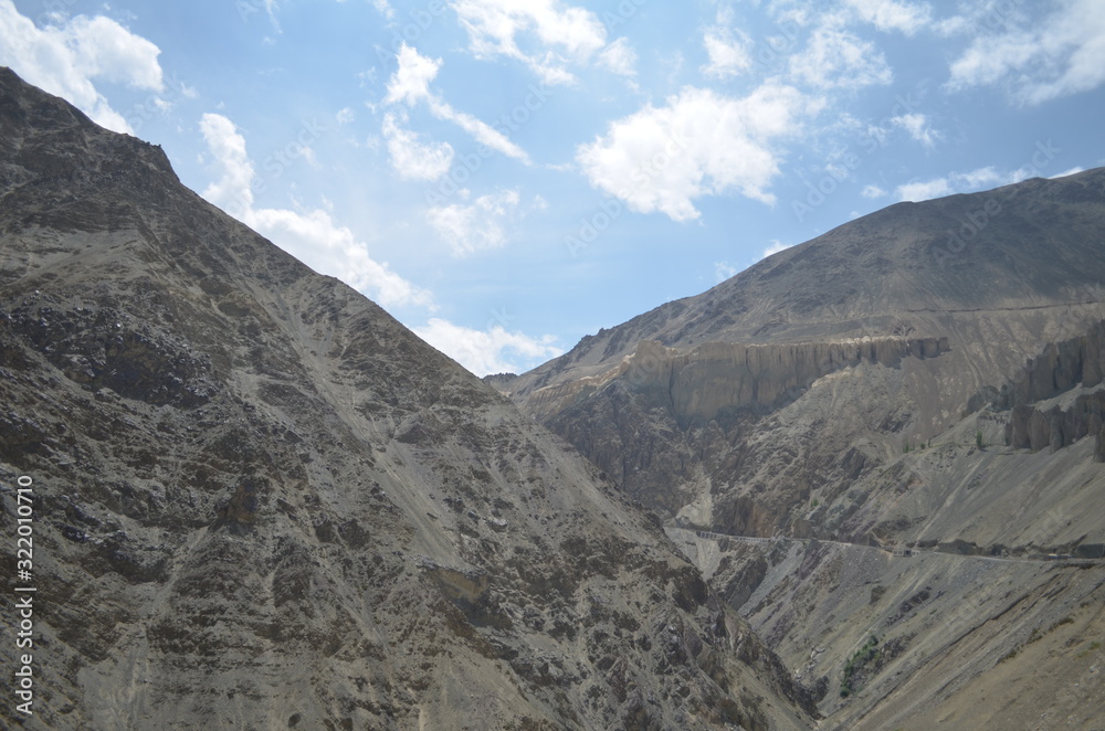 Naklejka premium the view of Himalaya mountains on a sunny day under the blue sky in the morning or the evening in Tibet India China the road on high altitudes