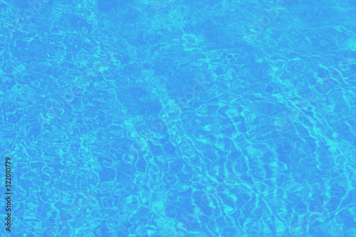 Low contrast pool water background in blue, azure texture