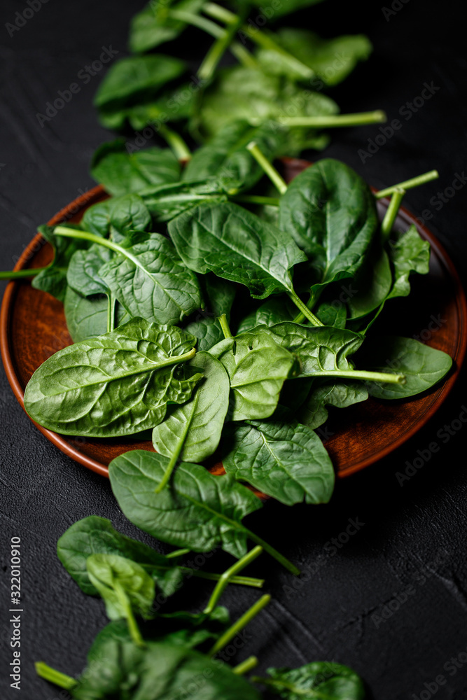 fresh spinach leaves on dark backgrownd. Top view fresh spinach leaves on dark backgrownd. Top view