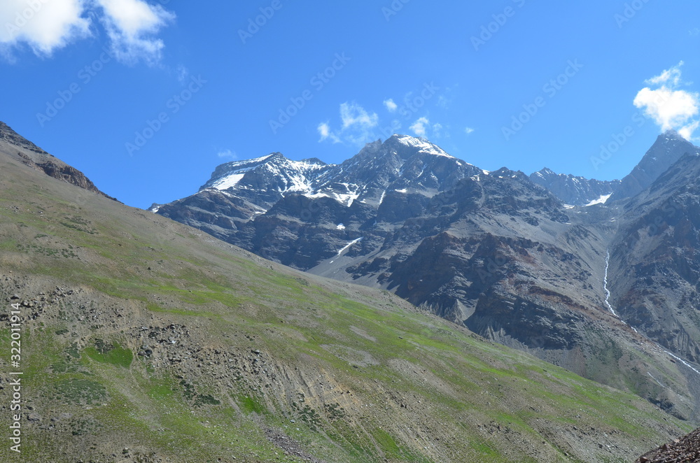 the view of Himalaya mountains on a sunny day under the blue sky in the morning or the evening in Tibet India China the road on high altitudes