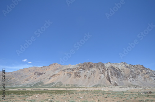 the view of Himalaya mountains on a sunny day under the blue sky in the morning or the evening in Tibet India China the road on high altitudes