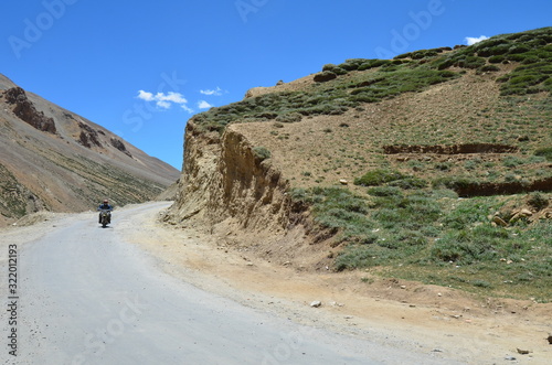 the view of Himalaya mountains on a sunny day under the blue sky in the morning or the evening in Tibet India China the road on high altitudes