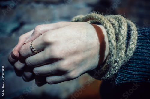 Hands of a bound girl close-up. Concept of kidnapping, violence © yaroslav1986