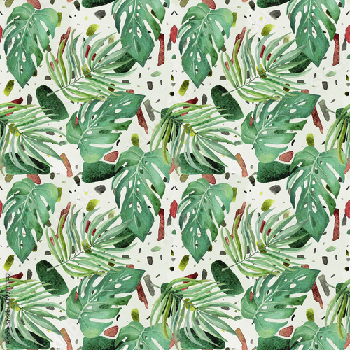 Watercolor seamless pattern consisting of monstera leaves and palm leaves on terazzo background.