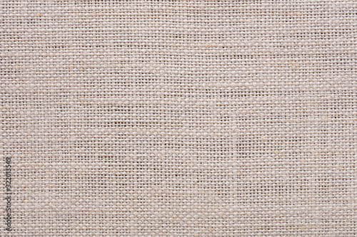 Light beige linen canvas background as part of your unique creative work.