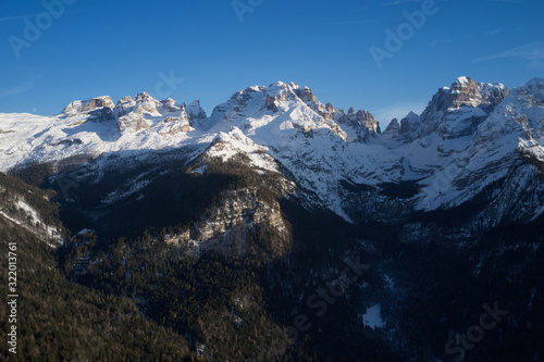 Panoramic aerial view of  Brenta Dolomites  Cima Tosa  Italy  snow on the slopes of the Alps  Madonna di Campiglio  Pinzolo  Italy. The most popular ski resorts in Italy. Aerial photography with drone