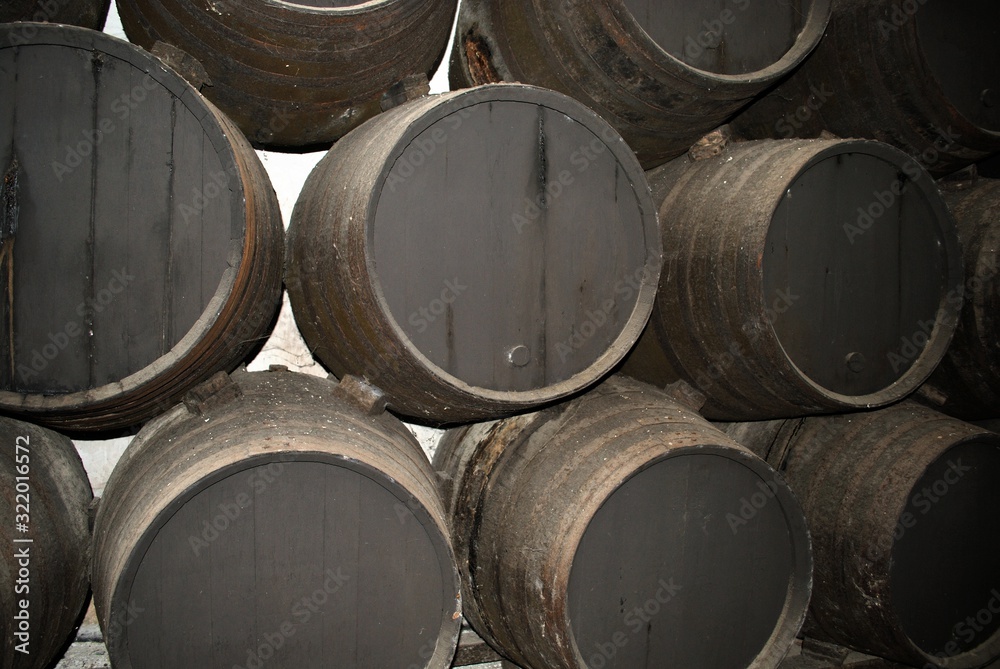 Traditional Spanish wooden sherry barrels in a warehouse, Jerez de la Frontera, Spain. Traditional Spanish wooden sherry barrels in a warehouse, Jerez de la Frontera, Spain.