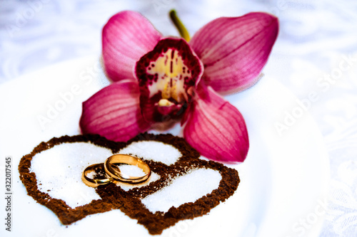 Wedding rings  tender orchids and coffee hearts