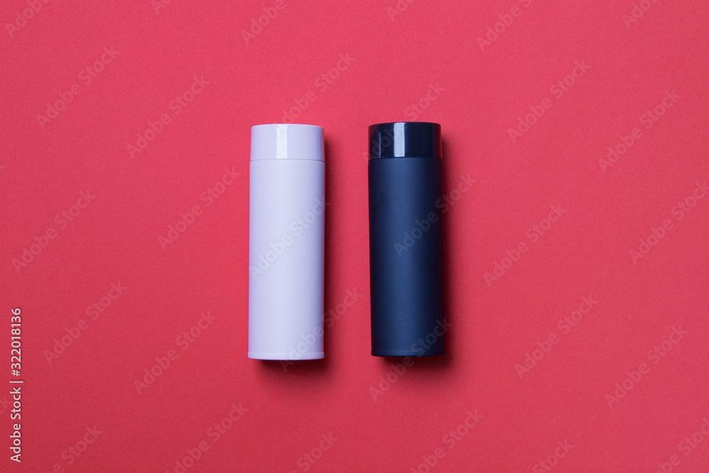 black and pink thermos cup on red background black and pink thermos cup on red background