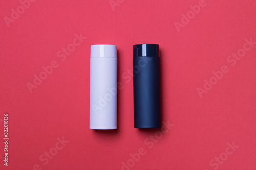 black and pink thermos cup on red background