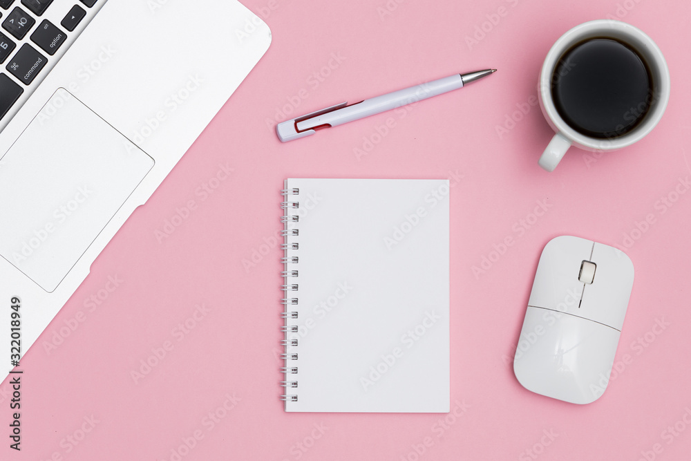 Minimal workplace with laptop, coffee cup and blank notepad on colored background. Top view. Flat lay Minimal workplace with laptop, coffee cup and blank notepad on colored background. Top view. Flat lay