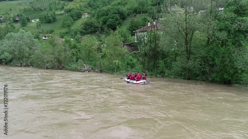 A rescue team is heading to the place where a person fell into the swollen river and dissapeared, the team is searching the river mouth, estuary, firth photo