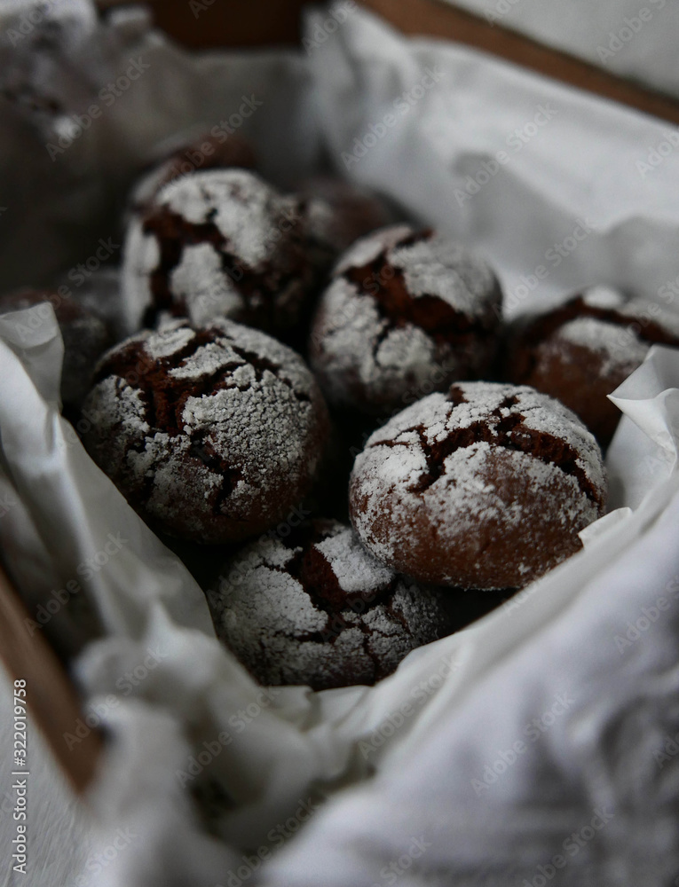 Homemade chocolate crinkles in a wooden box Homemade chocolate crinkles in a wooden box