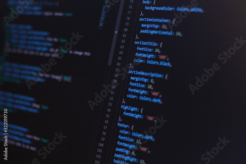 Close-up software developer programming code on screen