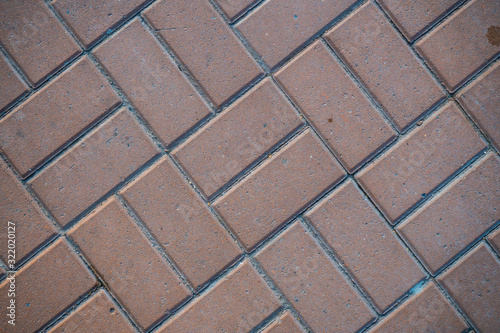 Texture of paving slabs overgrown with grass. Background image of a stratum stone photo