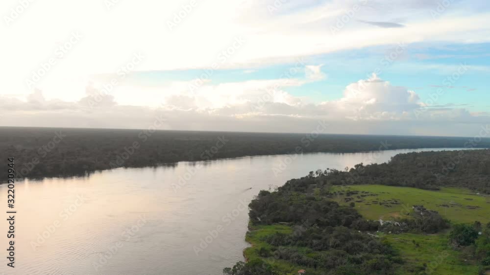 A Canoe´s aerial view sailing on the Amazon river, Colombia, 4k drone shot A Canoe´s aerial view sailing on the Amazon river, Colombia, 4k drone shot