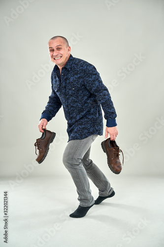 Man sneaking around tiptoeing