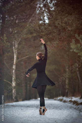 young woman in winter forest
