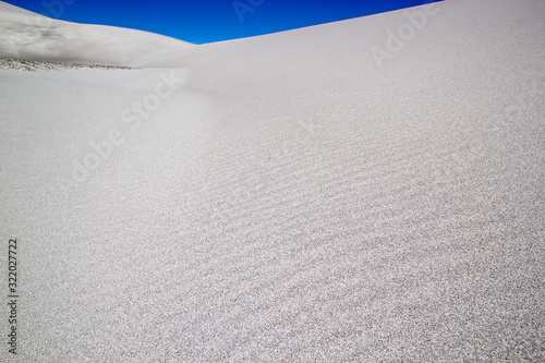 Sand of the white dune at the lava field of the volcano Caraci Pampa at the Puna de Atacama, Argentina photo