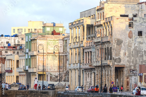 Photography Malecon promenade at sunset on the Atlantic Ocean in Havana, Cuba