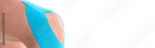 Cropped view of kinesiology tapes on knee of woman isolated on white, panoramic shot