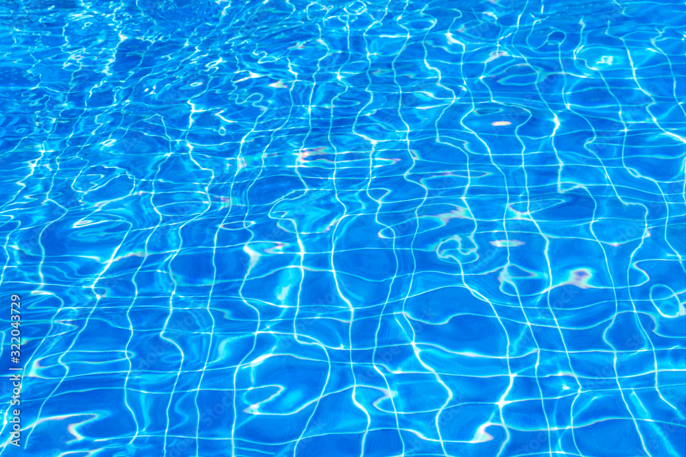 Pure clear ripped blue swimming pool water background