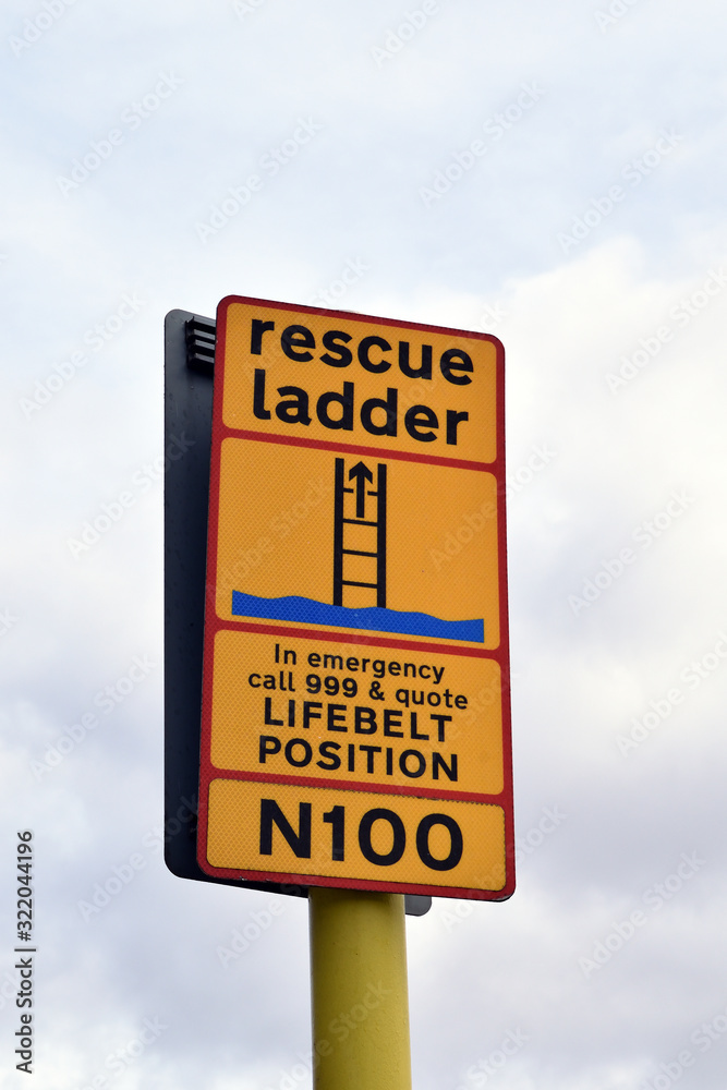 Yellow Emergency Rescue Sign on Pole Yellow Emergency Rescue Sign on Pole