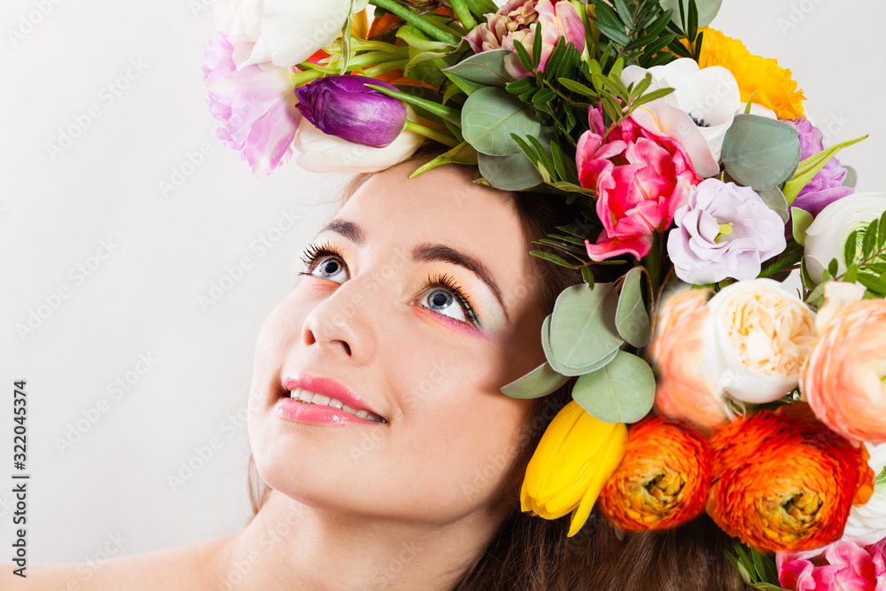 Beautiful lady with a wreath of spring flowers Beautiful lady with a wreath of spring flowers