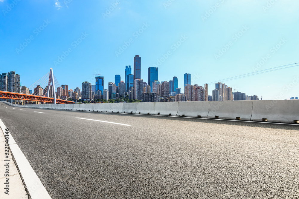 Empty asphalt road and urban landscape in Chongqing