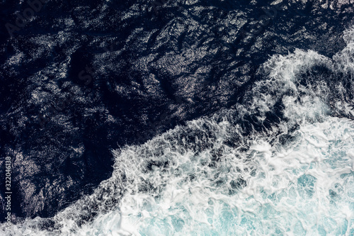 top view of the ocean with large waves from the ship. sea background.
