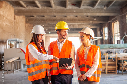 Engineers wearing safety helment meeting and discuss for work planning photo