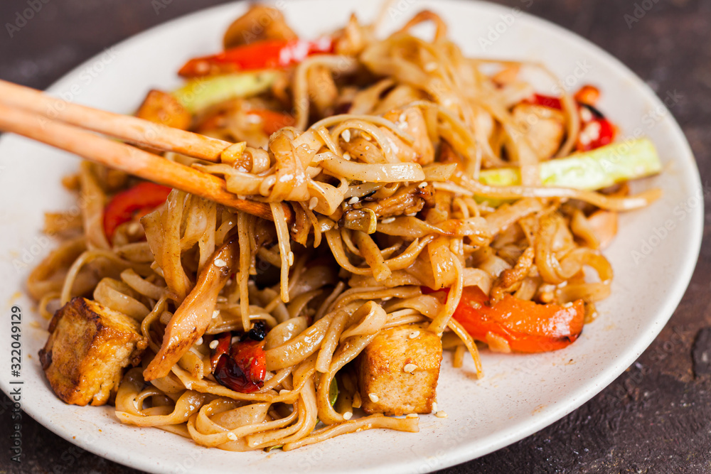 Asian vegan udon noodles with tofu and vegetables Asian vegan udon noodles with tofu and vegetables
