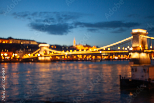 Blurred Budapest chain bridge on danube river. Famous sights at landmark Buda riverbank.