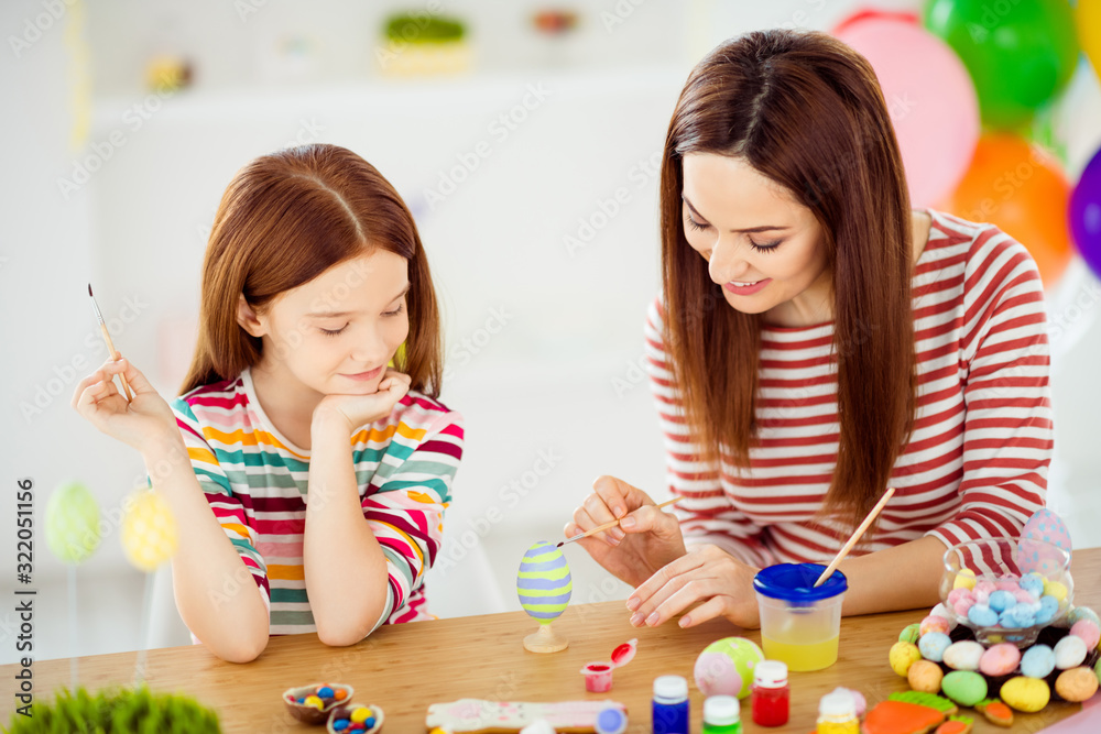 Fototapeta premium Close-up portrait of nice attractive lovely foxy ginger cheerful cheery girls small little daughter creating handicraft artwork April in white light interior room house indoors
