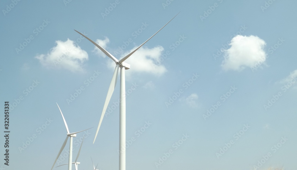 wind turbine against blue sky wind turbine against blue sky