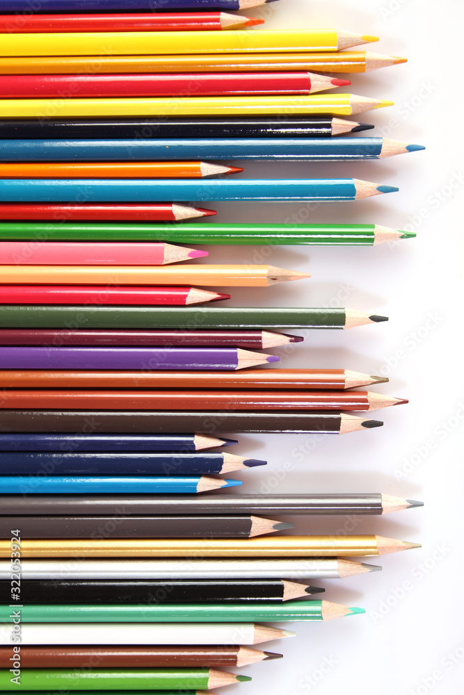 Fototapeta premium Colored pencils lie in a row