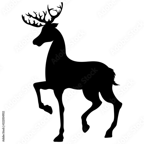 silhouette black horned deer stands with raised leg