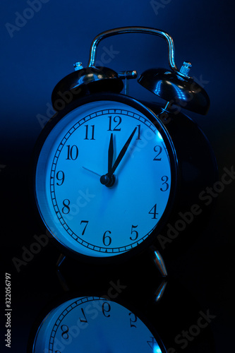 Alarm clock close up on black background