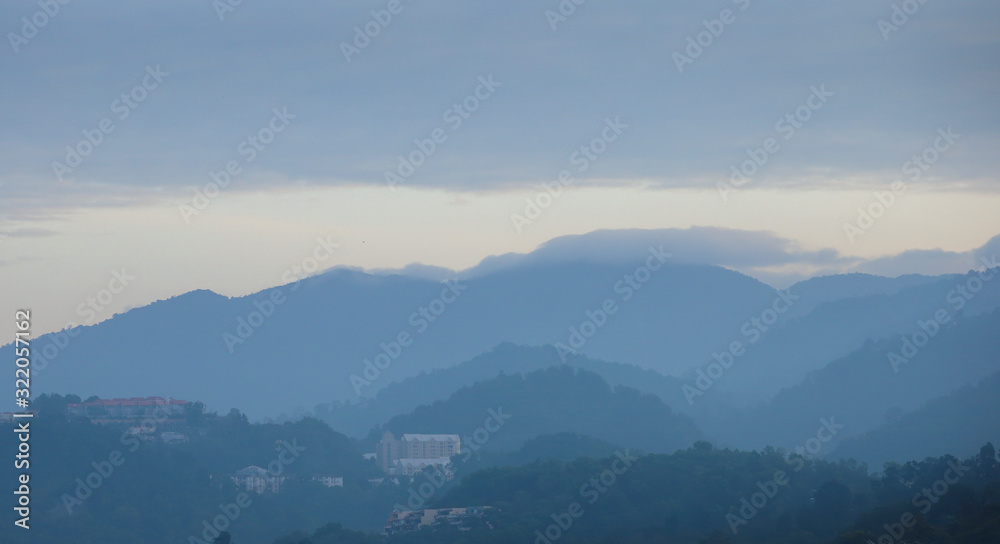 Layers of mountains in the morning fog