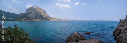 Obraz na płótnie View of the Green Bay in the village of New World, coastal cliffs and a ridge of mountains on the horizon. View of Mount Falcon. Black Sea coast, Sudak region, Republic of Crimea w salonie